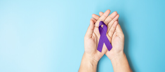 Pancreatic Cancer, world Alzheimer, epilepsy, lupus and domestic violence day Awareness month, Woman holding purple Ribbon for supporting people living. Healthcare and World cancer day concept
