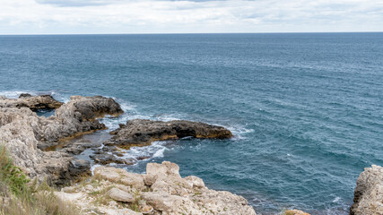 Cape Tarkhankut is one of the most beautiful and unusual places on the Crimean peninsula. Mountain formation on the sea near land in the afternoon