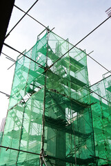 SEREMBAN, MALAYSIA -MAY 24, 2020: Temporary access and metal staircase made from staging, scaffolding and metal platform. Workers used it at the construction site to work at height. 