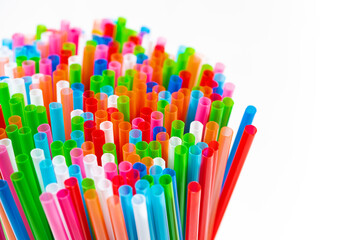 colored plastic tubes for cocktails on white background