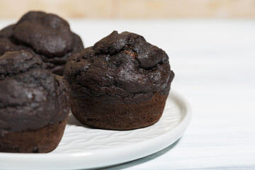 delicious chocolate muffins on a plate