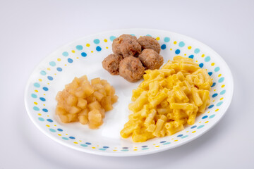 Delicious Macaroni and Meatball child’s dinner served on a plate