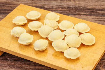 Fototapeta na wymiar Raw dumplings over board for cooking