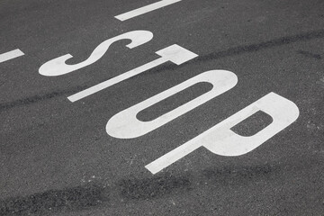 Asphalt road surface with inscription