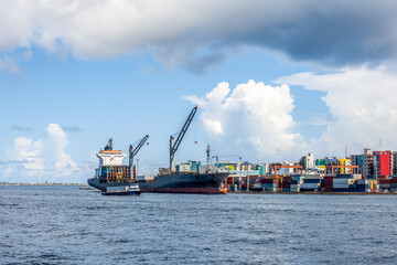Cargo ships in the port of Male city, the capital of the Republic of Maldives located on an island...