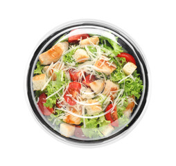 Delicious fresh salad in plastic container with lid on white background, top view