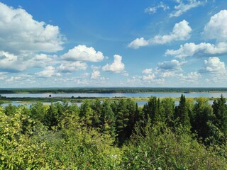 view from the mountain to the river and green forest along the coastline