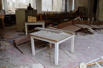 Old broken furniture in an abandoned building in Pripyat. A room in an abandoned kindergarten in the Chernobyl exclusion zone.