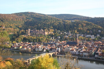 Fototapeta na wymiar Aerial view of Heidelberg old town and Castle with Old Bridge over the river Neckar during sunset in autumn in Heidelberg, Germany
