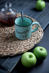Tea set on a wooden table, on a dark background.