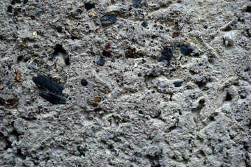 The gray surface of the wall of cinder block