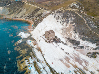 Punta Bianca, Agrigento in Sicily Italy -  White beach with old ruins of abandoned stone house on white cliffs