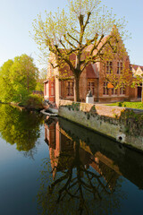 Obraz premium Buildings reflecting in the water, Historic centre of Bruges, Belgium, Unesco World Heritage Site.Weltkulturerbe.