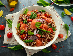 Buckwheat salad with smoked salmon, cherry tomato, red onion and greens