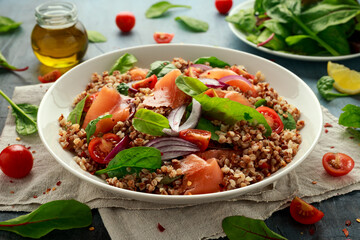 Buckwheat salad with smoked salmon, cherry tomato, red onion and greens