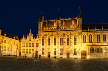 Fototapeta na wymiar Illuminated Burg plaza at night, Historic centre of Bruges, Belgium, Unesco World Heritage Site.