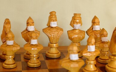 wooden chess pieces on a chessboard