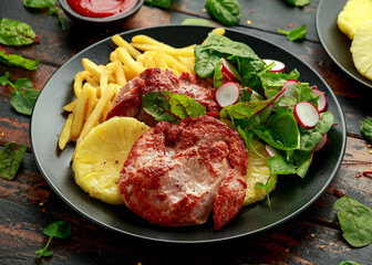 Fried Gammon steak with pineapple, french fries and vegetables