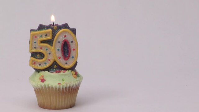 50th birthday cake with a candle