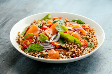 Buckwheat salad with smoked salmon, cherry tomato, red onion and greens