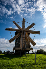 rural landscape with a mill, wooden church and old buildings on the island