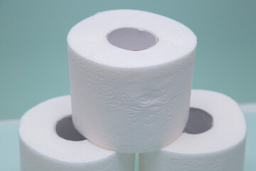 Toilet paper on a green background. Hygiene product.