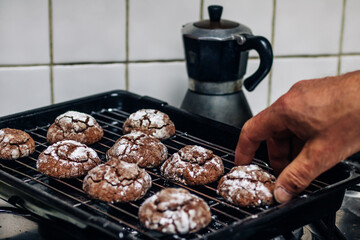 Crunchy chocolate cookies drying on a rack 