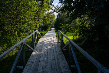 rural scenery with gray wooden pier on island