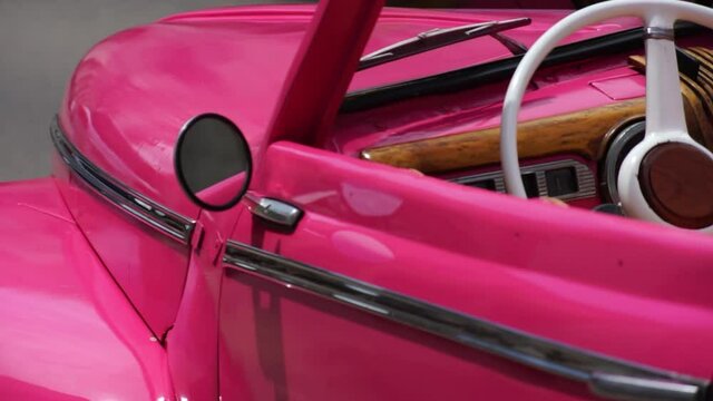 Detail of pink classic American car in Havana, Cuba, 2020