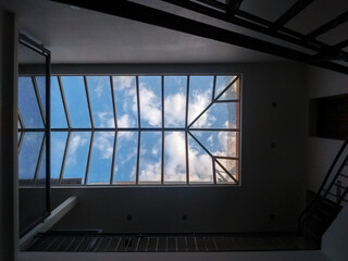Glass ceiling, indoors, with sky view