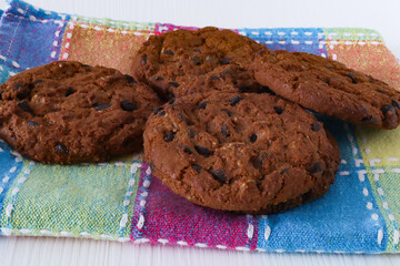 Chocolate chip cookies on kitchen towel