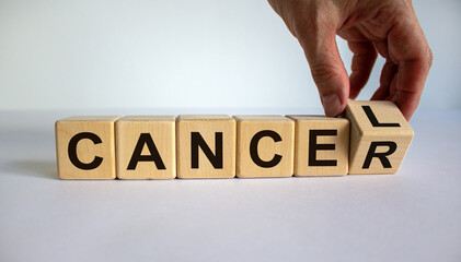 Symbol for stopping cancer. Hand turns a cube and changes the word 'cancer' to 'cancel'. Beautiful...