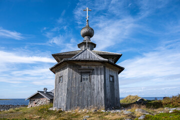 old wooden church on a desert island in the white sea