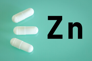 Zinc. capsules and the written chemical formula Zn, Strengthening of immunity