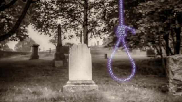A ghostly, glowing purple noose appears in a sepia graveyard it then fades to sepia. Shallow depth of field, focus on noose.