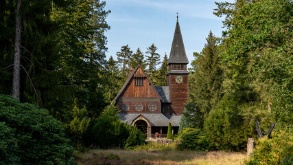historical cemetery chapel stahndorf, dark tv series, stave church in the forest