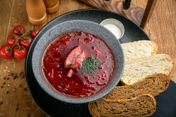Borsch from the menu of a Ukrainian restaurant. On a wooden table
