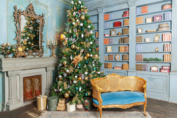 Fototapeta na wymiar Classic Christmas New Year decorated interior room home library with fireplace. Christmas tree with gold ornament decorations. Modern classical style interior design apartment. Christmas eve at home.