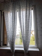 Kitchen window with folded curtains. Gothenburg Sweden