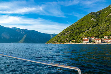 Bay of Kotor from a boat, sea among green mountains, Montenegro