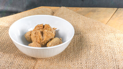Indonesian meat balls ‘‘bakso” homemade, on white bowl