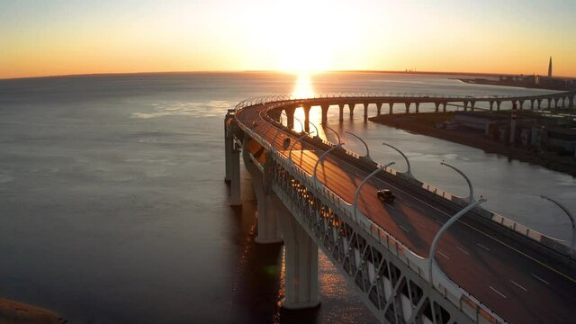 High-speed toll road, highway bypassing the city center St. Petersburg, the central section of the western high-speed section. A beautiful view of the sunset over the Gulf of Finland.