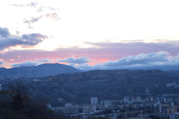 Fototapeta premium Mountain landscape at sunset. Art summer background. Blue sky and white clouds. 
