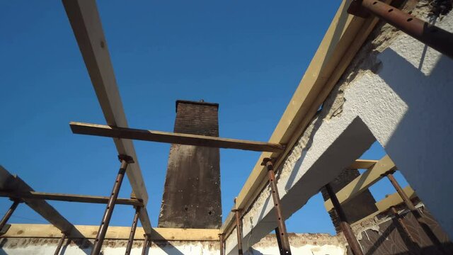 Building under construction. Metal shuttering supported by props being ready for casting concrete slab