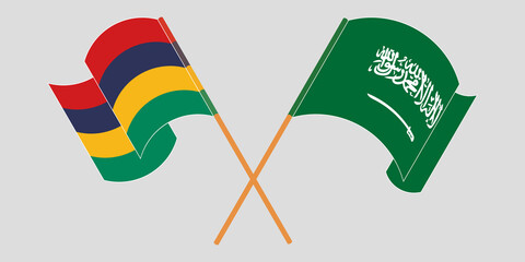 Crossed and waving flags of Mauritius and the Kingdom of Saudi Arabia