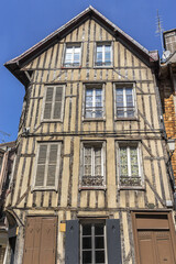 Fototapeta na wymiar Architectural fragments of beautiful ancient half-timbered house (mainly of XVI century) in Troyes. Troyes is a commune and the capital of Aube department (Champagne region) in north-central France.