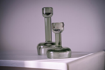 candle holders on a shelf