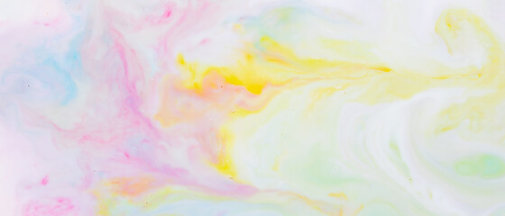 Fluid art. Multicolored background from liquid. Photography of colored spots on liquid. Abstract pattern