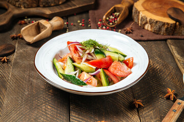 Fresh vegetables mix salad in a white plate