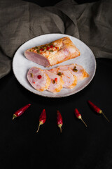 Meat sausage on a board with sauce